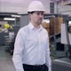 Shot of Professional Factory Worker Wearing Hard Hat Holds Tablet Computer Walking Thorugh Modern - VideoHive Item for Sale