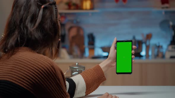 Caucasian Woman Holding Smartphone with Green Screen