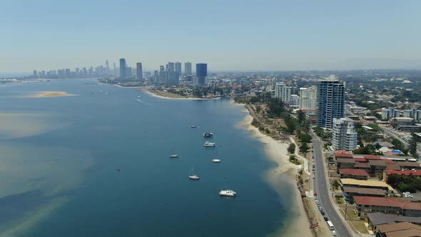 Slow turn right,  drone footage, shot at Labrador looking south at the skyline of Southport and Surf