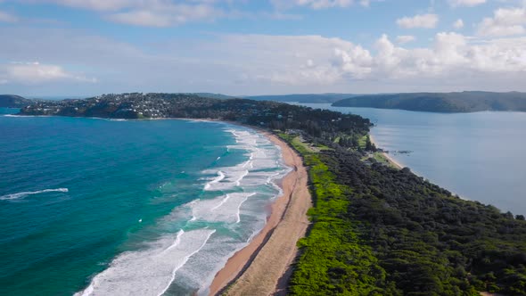 Palm Beach, Australia. Beautiful, Narrow Beach Line, Ocean Waves Sand and Green Vegetation.