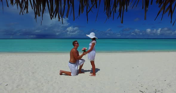 Beautiful couple married on vacation have fun on beach on clean white sand 4K background