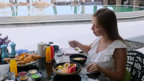 Smiling Woman on Continental Breakfast in Luxury Hotel Eating Healthy Food