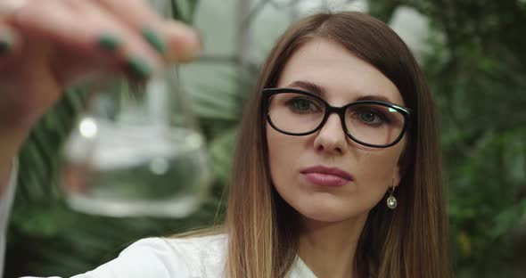 Female Scientist Holding Ampoule in Hand New Medication Developing Vaccination