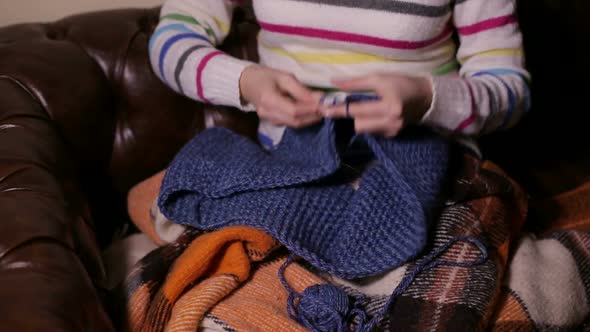 Young Woman Crocheting at Home