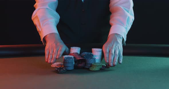 Poker Player Pushing Stack Of Chips in Slow Motion