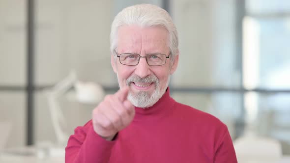 Old Man Pointing at Camera Inviting