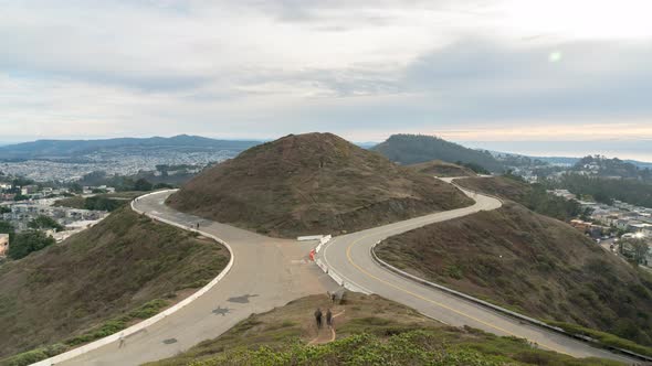 Time Lapse: People walking and hiking in the hills and road.