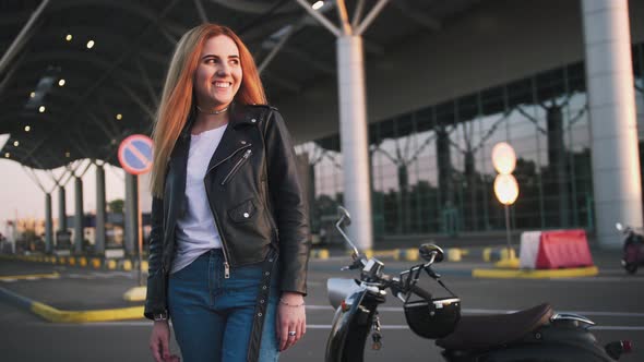 Young Stylish Woman Wearing Leather Jacket Woman Near Vintage Scooter on Urban Background