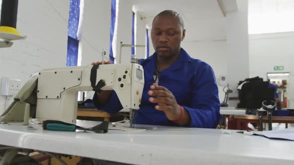 Worker sewing a tissue
