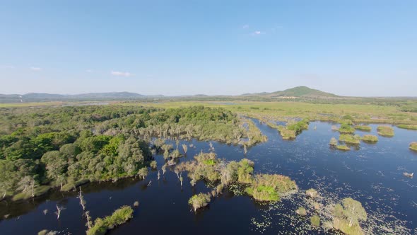 Aerial: High lansdcape shot of Botanical Garden in Rayong, Thailand. Circular tracking shot of float