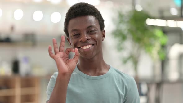 Young African Man Showing OK Sign