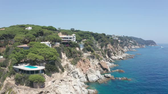 Aerial Shot of Rocky Sea Coast Near Resort Town