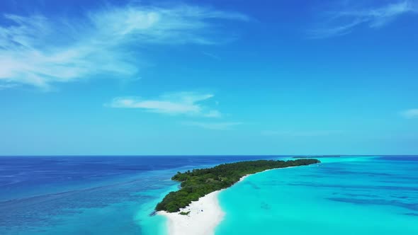 Aerial above tourism of idyllic lagoon beach vacation by blue ocean with white sand background of ad