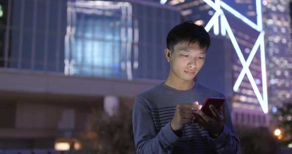 Man Using Mobile Phone at Outdoor