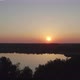 Countryside Dramatic and Colorful Sunset Flight Over a Forest Lake Aerial Shot on a Drone - VideoHive Item for Sale