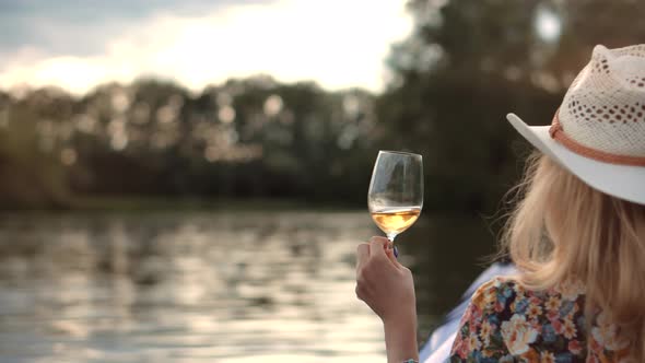 Woman Drinking White Wine On Holidays Vacation. Romantic Evening Enjoying Wineglass.