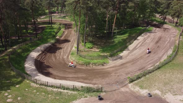 Motorcycles on motocross terrain in the forest in Halle, The Netherlands