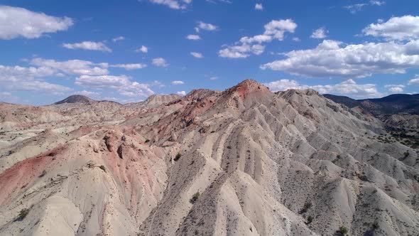 Flying over colorful mountain range in Utah