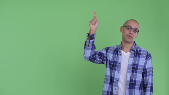 Stressed Bald Hipster Man Pointing Up