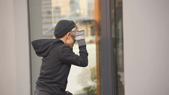 Joyful Street Boy Leaned on Window of Food Shop