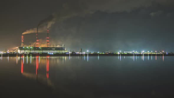 Time lapse of coal power plant high pipes with black smoke moving fast polluting atmosphere