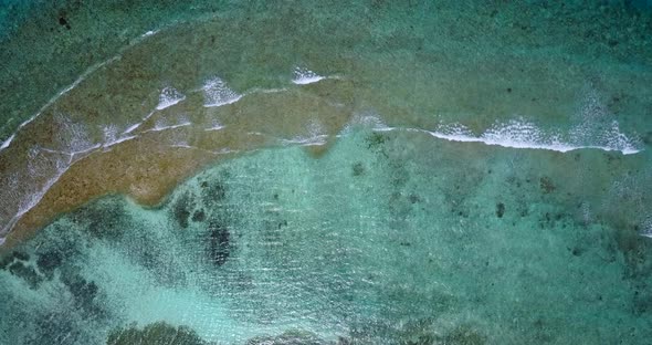 Natural above clean view of a white sandy paradise beach and aqua turquoise water background in best