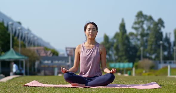 Woman do yoga at park