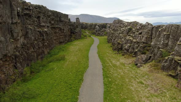 Footpath between tectonic plates in Thingvellir National Park in Iceland