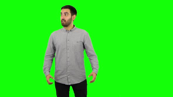 Brunette Guy Is Very Angry and Screaming. Green Screen