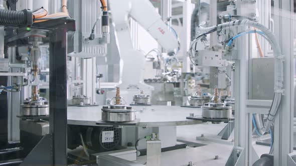 Advanced robotic machine manufacturing parts in an automated assembly line