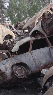 Vertical Video of a Dump of Destroyed Cars During the War in Ukraine