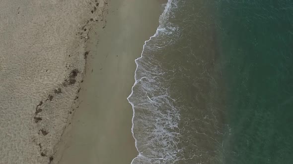 Aerial Drone View of Tropical Beach Ocean Waves Reaching Shore