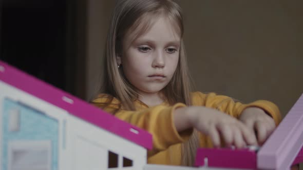 Girl Playing With Toys At Home