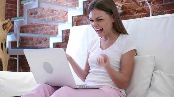 Positive Happy Woman Celebrating Success While Working on Laptop