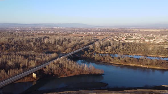 Bridge And Traffic On The River