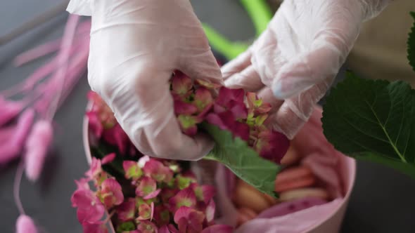 Woman Pastry Chef Putting Flowers in a Box