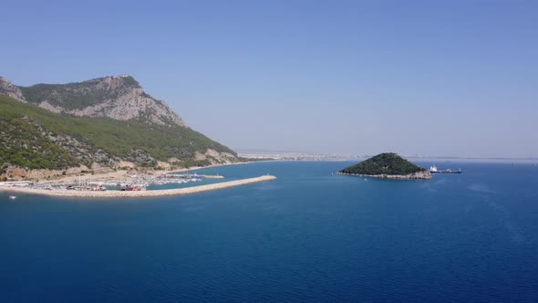 Aerial View of the Sea with Port and Mountains in the Background