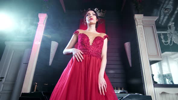 Beautiful Elegant Woman in Amazing Evening Red Dress Dancing at Luxury Vintage Interior Low Angle