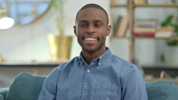 Young African Man Shaking Head in Approval