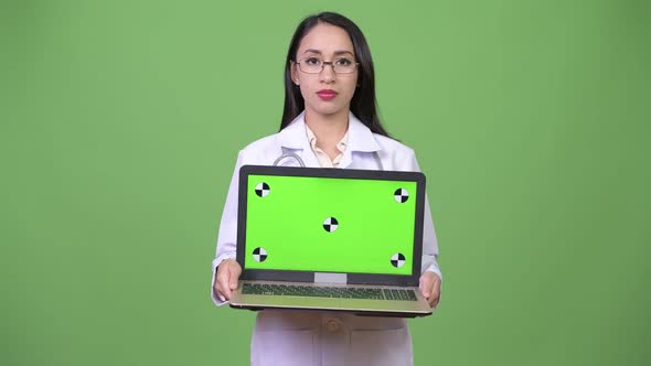 Young Beautiful Asian Woman Doctor Showing Laptop