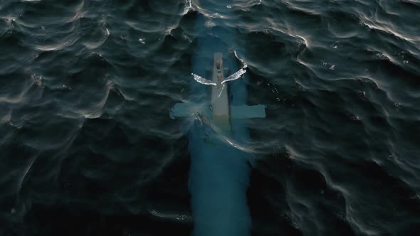 Submarine Patrolling Just Below The Water's Surface At Periscope Depth