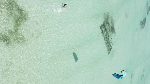 Vertical Video Kitesurfing Near the Shore of Zanzibar Tanzania Aerial View