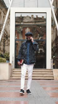 Stylish African Young Man Outside with His Smartphone