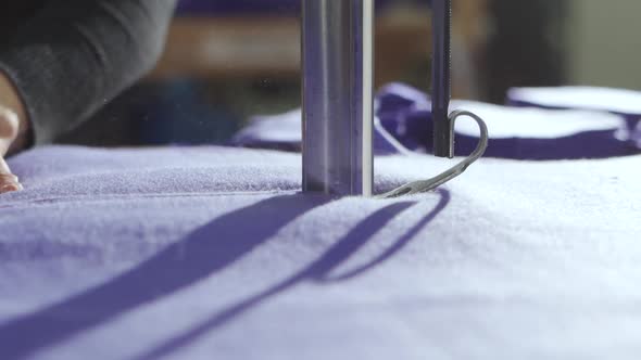 Cutting Fabric on the Table with an Electric Cutter Sewing Production of Clothing