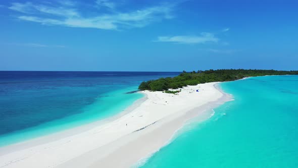 Wide angle flying clean view of a white sand paradise beach and blue water background in colourful 4