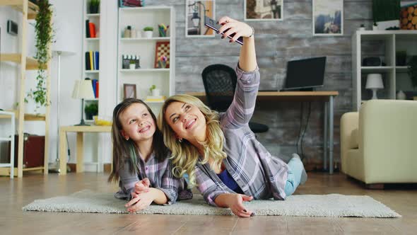 Mother and Daughter Lying on the Floor