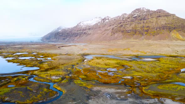 Magical Aerial Flight Over Iceland a Volcanic Landscape with Yellow Moss and Turquoise Lakes From a