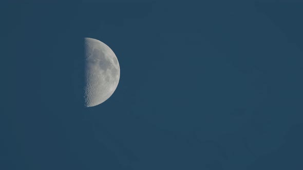 Moon Moving to the Right with Blue Evening Sky