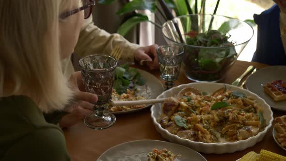 family having dinner at the table indoor at home