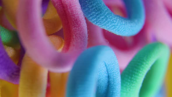 Vertical View of a Vivid Colors Rotating Close Up Textile Rubber Bands